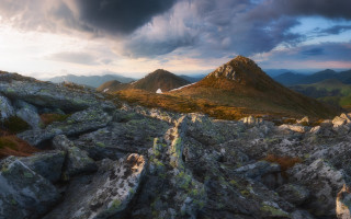 Mountain range cloudy sky rocks - a few rock below free wallpaper