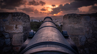 Cannon sunset castle city clouds - a view of a city free wallpaper