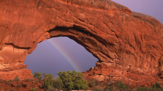 Rainbow arch desert landscape mountain - a rainbow in the sky free wallpaper