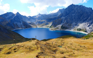 Mountain range lake background cloudy 2 - a few mountain free wallpaper