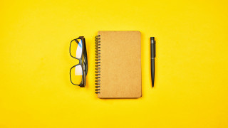 Notebook pen glasses yellow background - a notebook free wallpaper