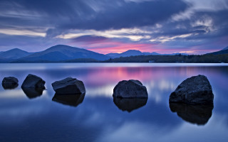 Rock lake mountains sunset cloudy - the background and a sunset free wallpaper