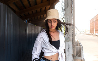 Woman hat fence posing fashion - her stomach free wallpaper