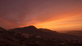 Sunset mountain range red sky 2 - a sunset view of a mountain range free wallpaper