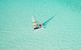 Sailboat blue ocean shadow hyperrealistic - a sailboat free wallpaper