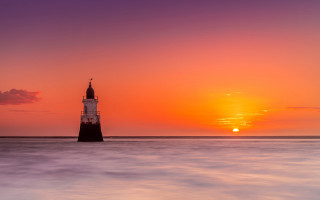 Lighthouse island ocean sunset boat - the sun setting free wallpaper for desktop