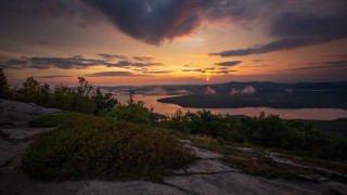Sunset lake mountains clouds city - the ground below free wallpaper