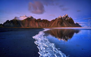 Mountain range water reflection sunset - a body of water in front free wallpaper