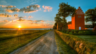 Dirt road red building tower - a red building free wallpaper