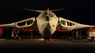 Large airplane runway night man - top of a runway free wallpaper