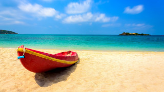 Red boat beach ocean island - a small island in the distance free wallpaper