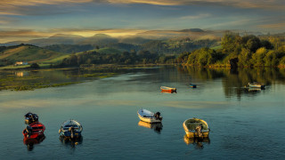 Boats lake forest horizon clouds - hillside under a cloudy sky free wallpaper