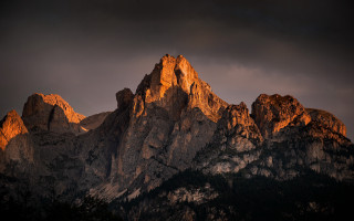 Mountain range dark sky clouds 2 - a dark sky in the background free wallpaper
