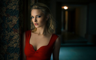 Woman red dress serious portrait - against a wall free wallpaper