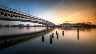 Bridge water sky clouds evening - a bridge over a body of water free wallpaper