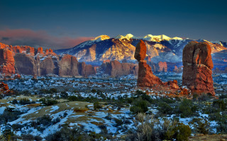 Mountain range snow rocks bridge - the foreground and a mountain range in the background free wallpaper