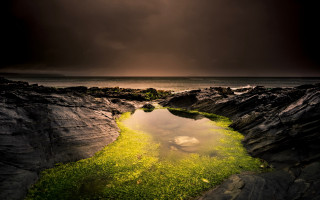 Night beach river rocks grass - moody free wallpaper