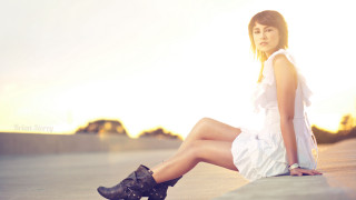 Woman sitting ledge crossed legs - black boot free wallpaper