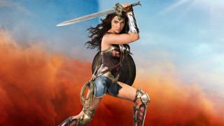 Feminist armor sunset sword woman - a sky background behind her free wallpaper