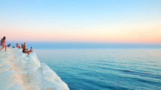 Cliff people ocean sunset beach - pastel color palette free wallpaper