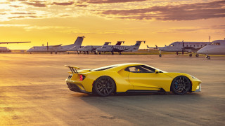 Yellow sports car runway sunset - a runway free wallpaper for desktop