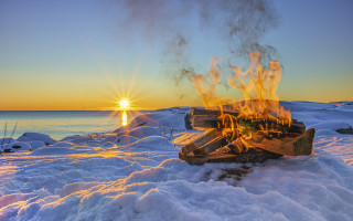 Fire pit snowy sunset water - a snowy surface free wallpaper