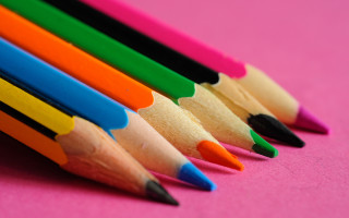 Colored pencils pink background childs - a pink surface free wallpaper