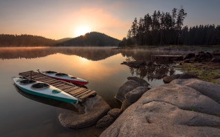 Boats lake mountains sunset foggy - a foggy sky free wallpaper for desktop