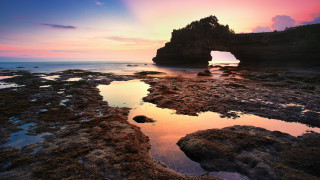 Rock formation hole sunset reflection - a hole in the middle of it free wallpaper