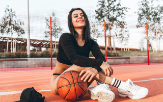 Woman sitting basketball shoes winter - brigette barrager free wallpaper