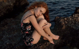 Woman rock ocean crossed legs - a rock next free wallpaper