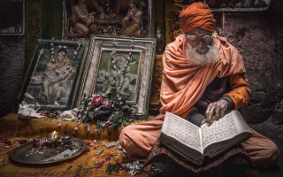 Man sitting reading book background - a floor free wallpaper