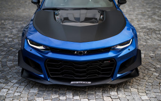 Blue sports car cobblestone street - sharp high detail free wallpaper