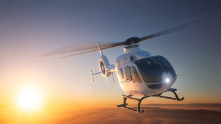 Helicopter clouds sunset sunlight lensflare - a helicopter free wallpaper