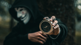 Creepy hooded person clock mask - a creepy mask free wallpaper