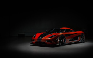 Red sports car dark room 94 - a black background and a spotlight free wallpaper