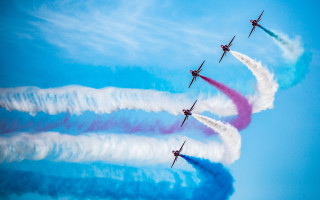 Four airplanes colored smoke blue - formation in the sky free wallpaper