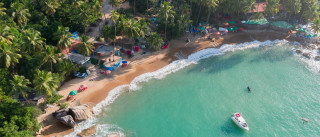 Beach boat people trees water - free beach wallpaper