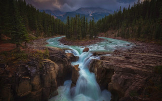 Waterfall forest cloudy sky mountain - a waterfall in a forest free wallpaper