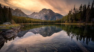 Mountain lake forest rocks cloudy 2 - under a cloudy sky free wallpaper