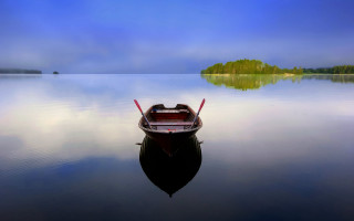 Small boat lake forest hillside - a small boat free wallpaper