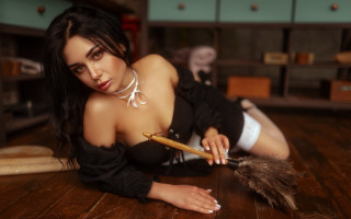 Black dress laying feather puzzle - a feather free wallpaper