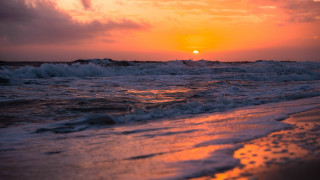 Sunset ocean waves beach person 8 - the shore and a person free wallpaper
