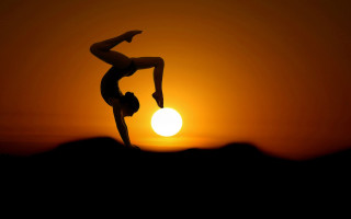 Handstand sunset silhouette moon orange - a handstand free wallpaper