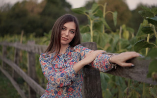 Woman fence sunflower bokeh portrait - in the foreground free wallpaper