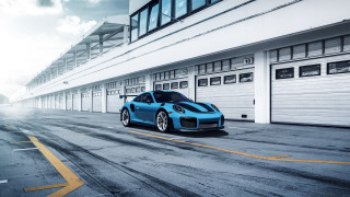 Blue sports car garage street - a garage door free wallpaper