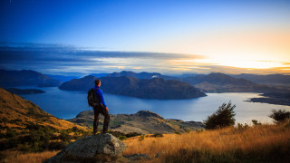 Mountain lake sunset man backpack - top of a mountain next free wallpaper