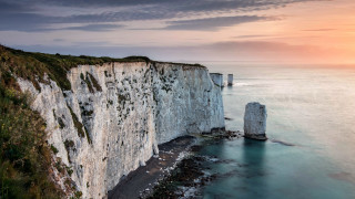 Cliff lighthouse sunset ocean mountains - a cliff free wallpaper