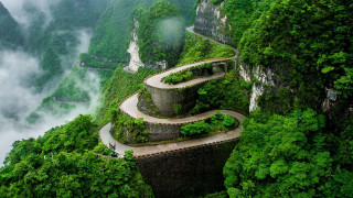 Mountain road cliff person scene - road free wallpaper