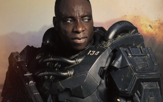 Futuristic man armor gun fire - bruce onobrakpeya free wallpaper